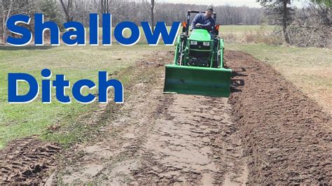 how to dig a ditch with a skid steer|john deere digging a ditch.